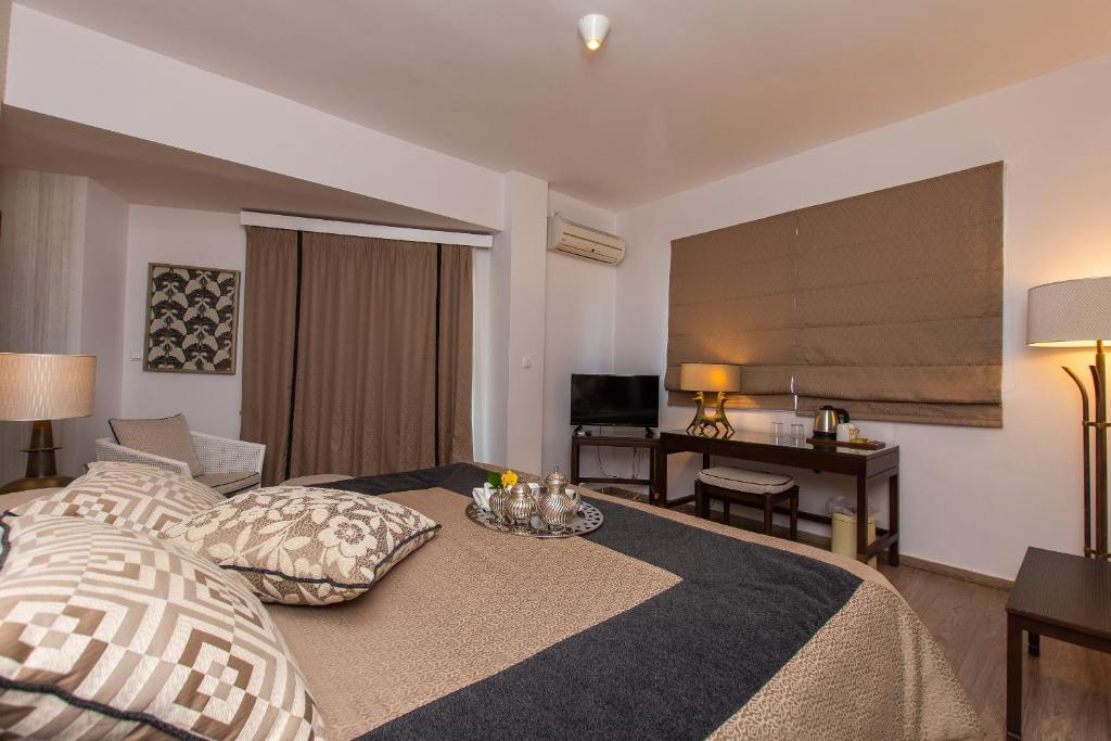 Postel nebo postele na pokoji v ubytování Mati Hotel