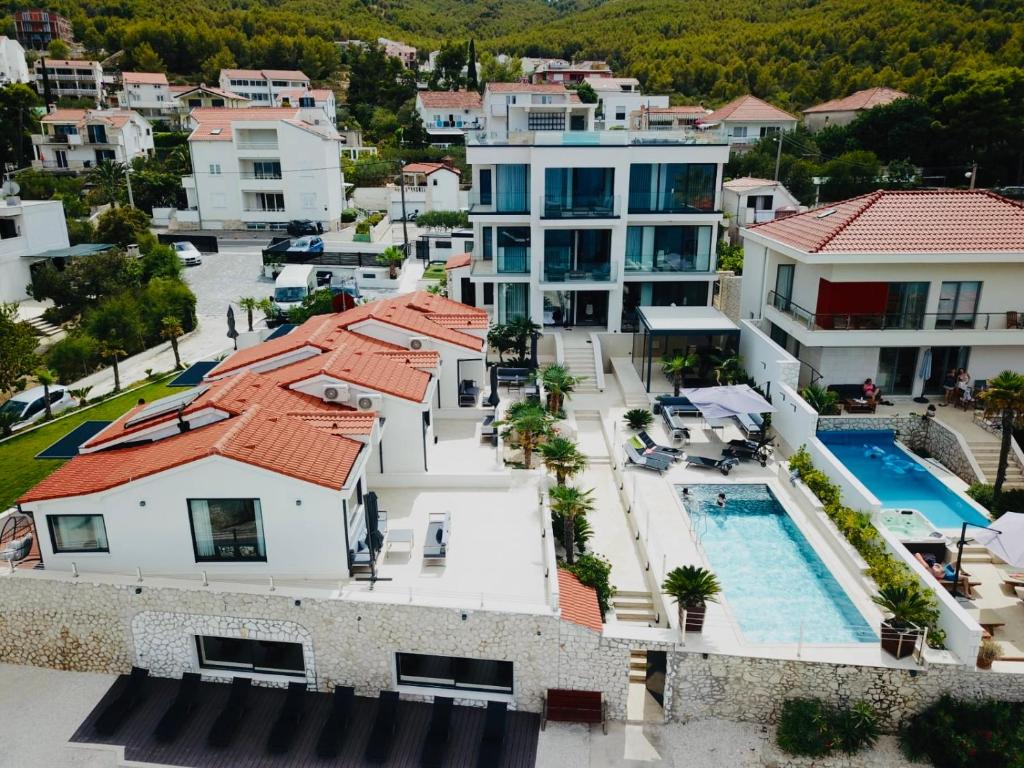 an aerial view of a house with a swimming pool at Villa Sun and Sea in Trogir