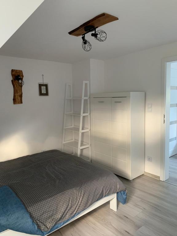 Posteľ alebo postele v izbe v ubytovaní Apartament DWA DĘBY