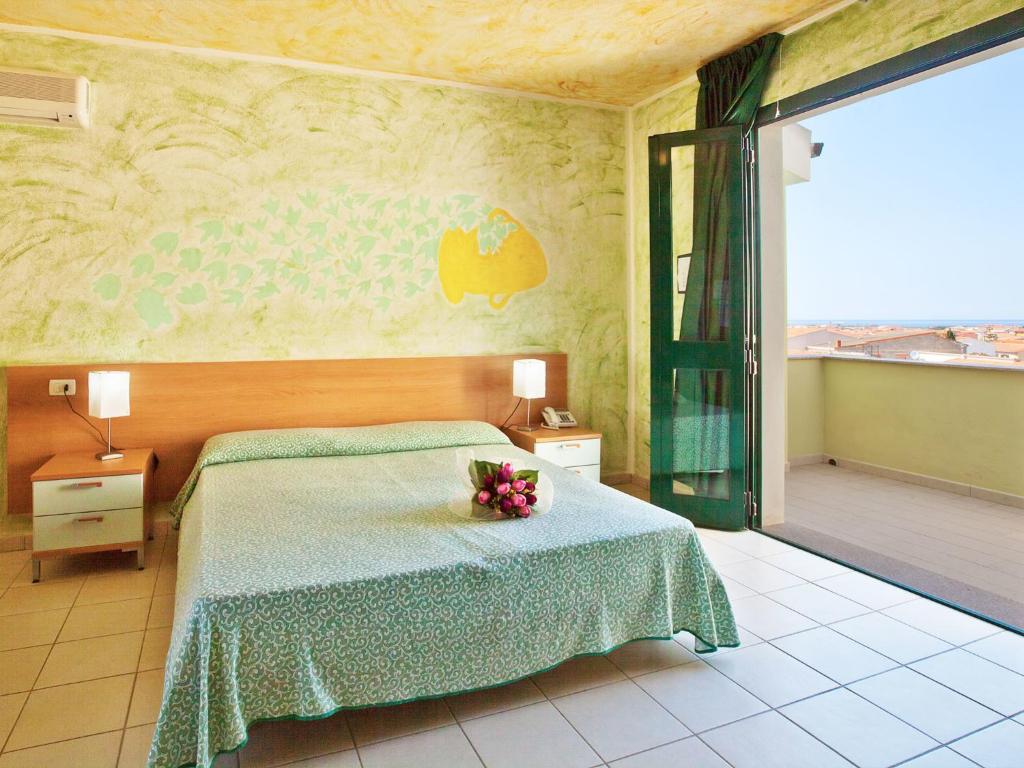 Postel nebo postele na pokoji v ubytování Hotel Ariadimari