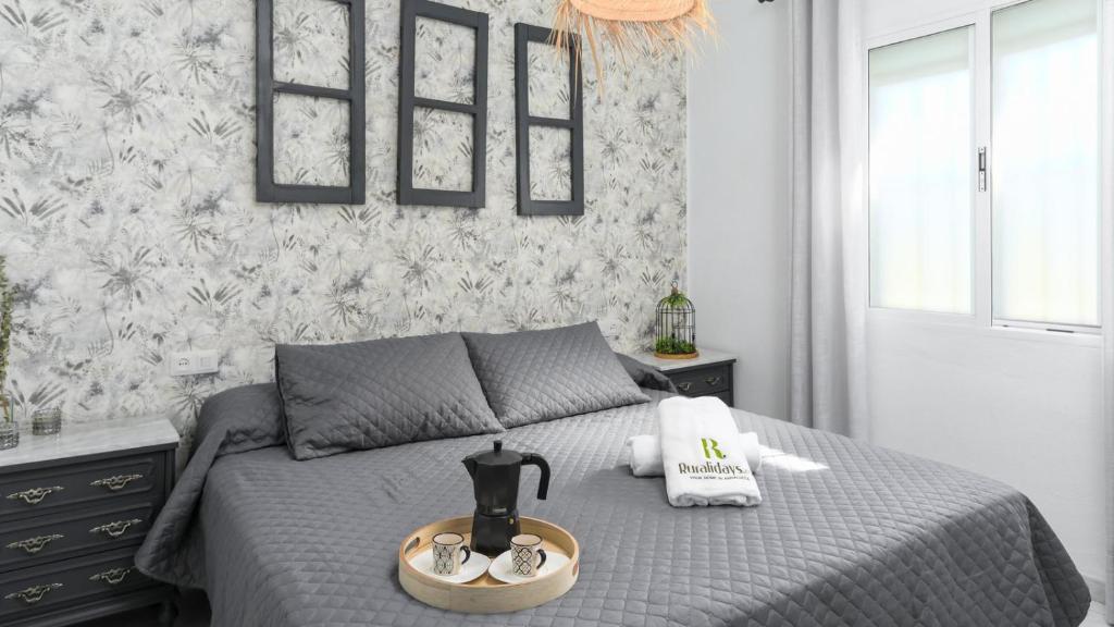 Łóżko lub łóżka w pokoju w obiekcie La Posada de Catalina Montecorto by Ruralidays