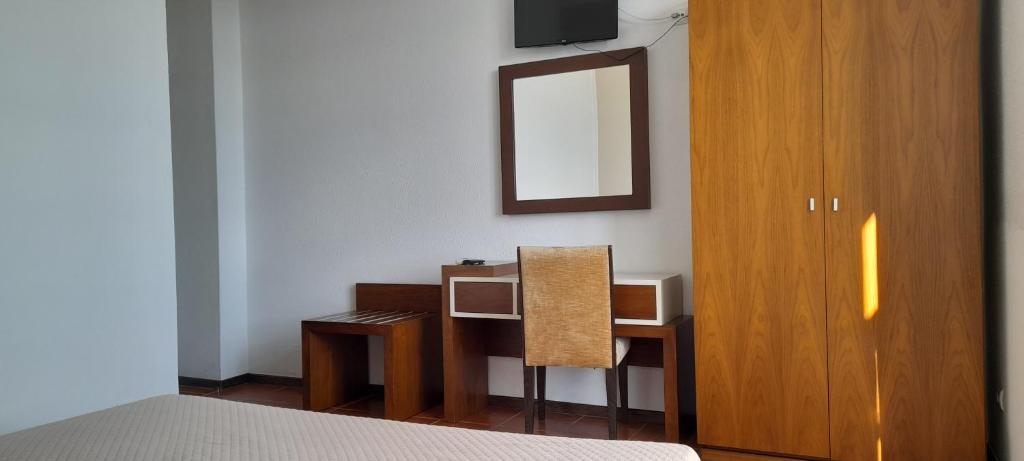Postel nebo postele na pokoji v ubytování Hotel Abade João