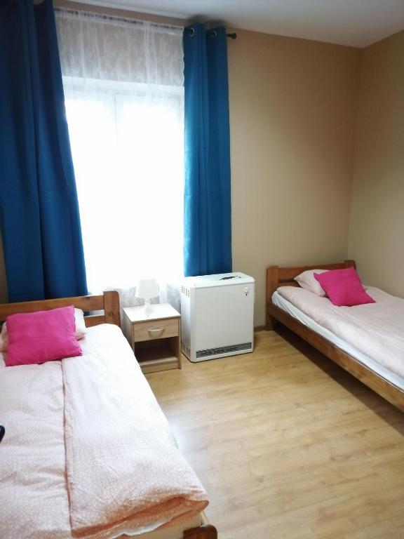 Postel nebo postele na pokoji v ubytování Hostel Gliwice Centrum PARKING