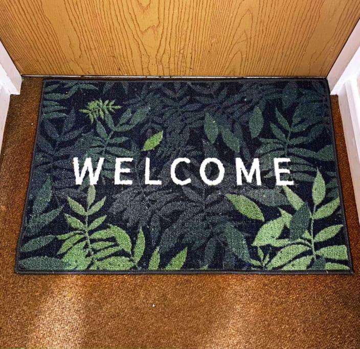 a welcome mat with the word welcome on it at Nottingham city view apartment in Nottingham