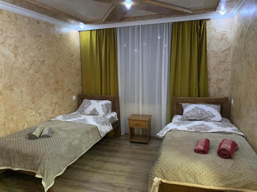 Postel nebo postele na pokoji v ubytování Guest House Diana