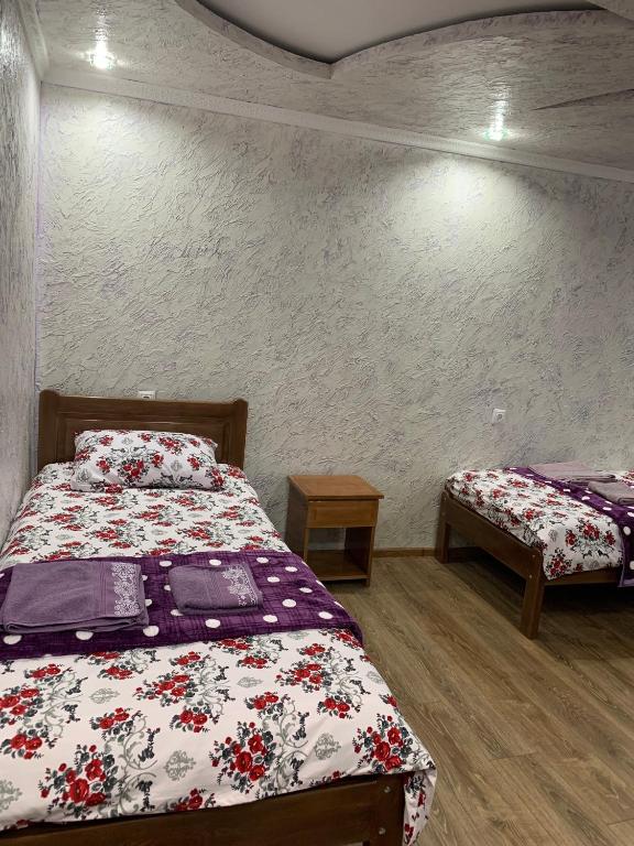 Postel nebo postele na pokoji v ubytování Guest House Diana