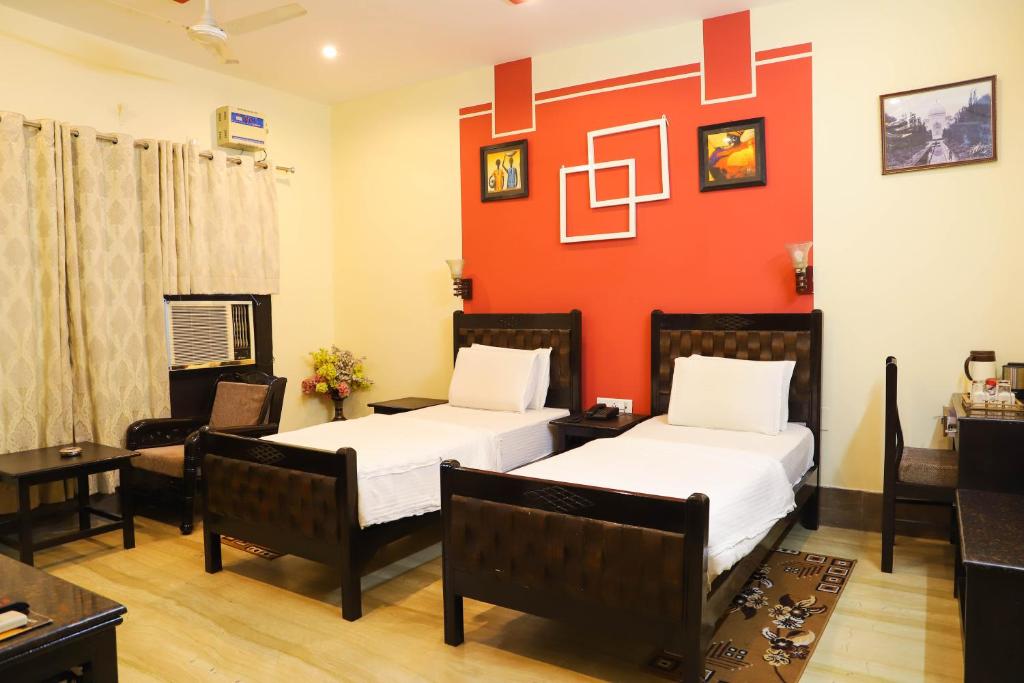 Postel nebo postele na pokoji v ubytování Pearl of Taj Home Stay