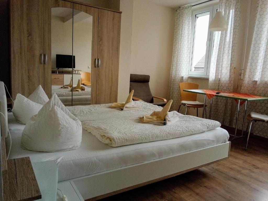 Postel nebo postele na pokoji v ubytování Hotel Ratscafe Ückeritz