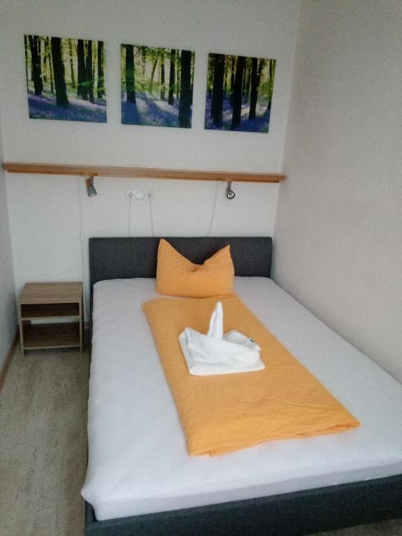 Postel nebo postele na pokoji v ubytování Hotel Ratscafe Ückeritz