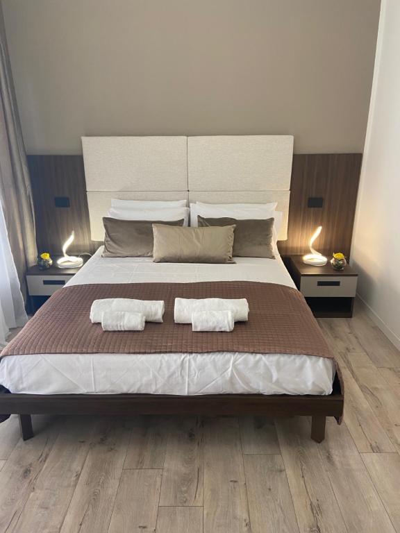 Postel nebo postele na pokoji v ubytování Hotel Plaza Ungheria