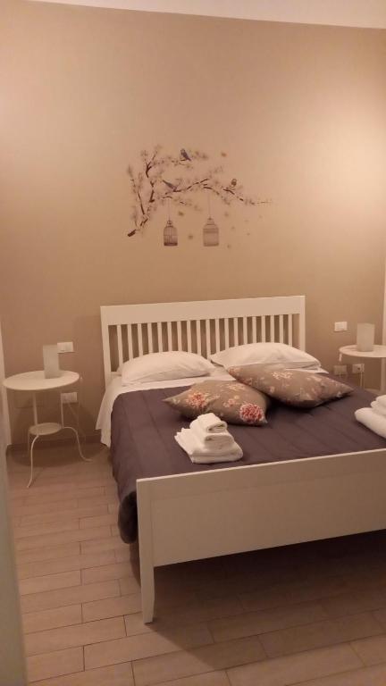 Posteľ alebo postele v izbe v ubytovaní A casa di Marghe