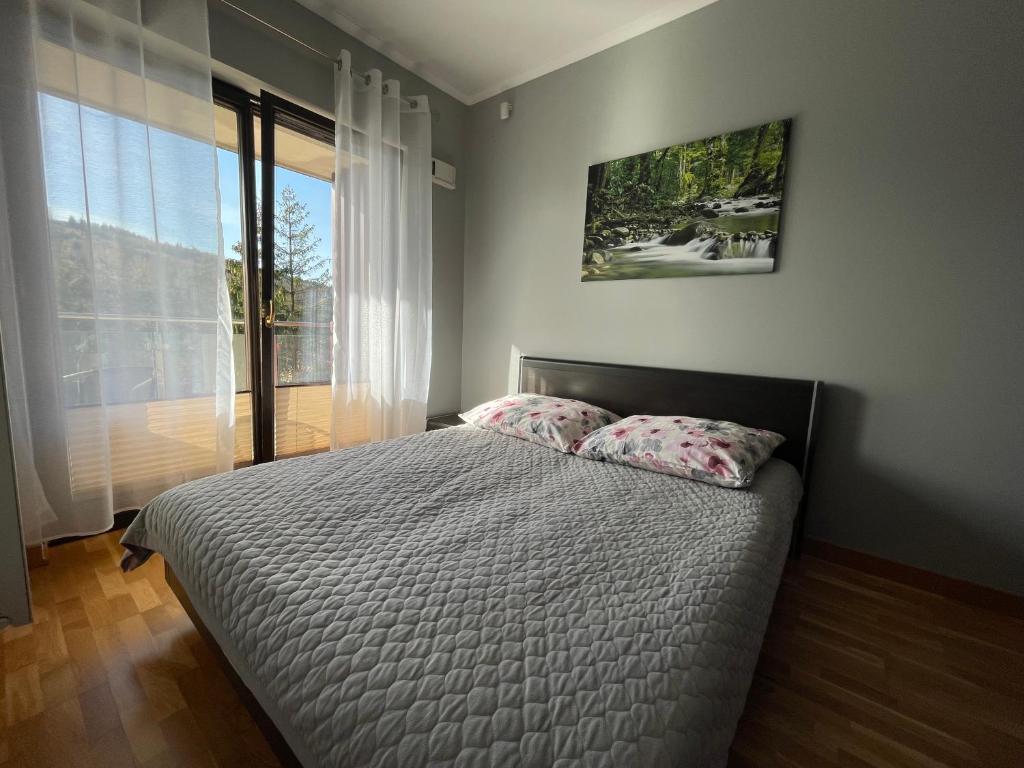 Posteľ alebo postele v izbe v ubytovaní Apartament Słoneczny