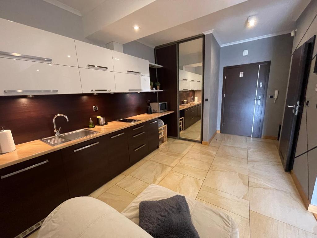 Kuchyňa alebo kuchynka v ubytovaní Apartament Słoneczny