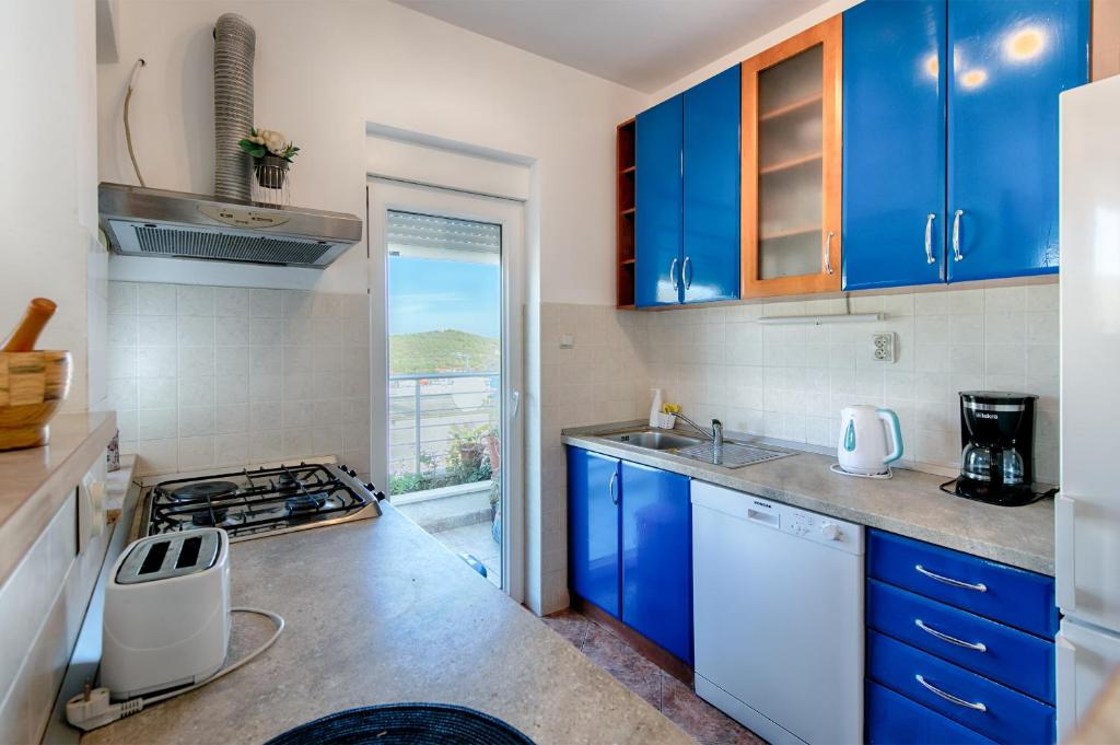 Kuchyň nebo kuchyňský kout v ubytování Apartment Diva