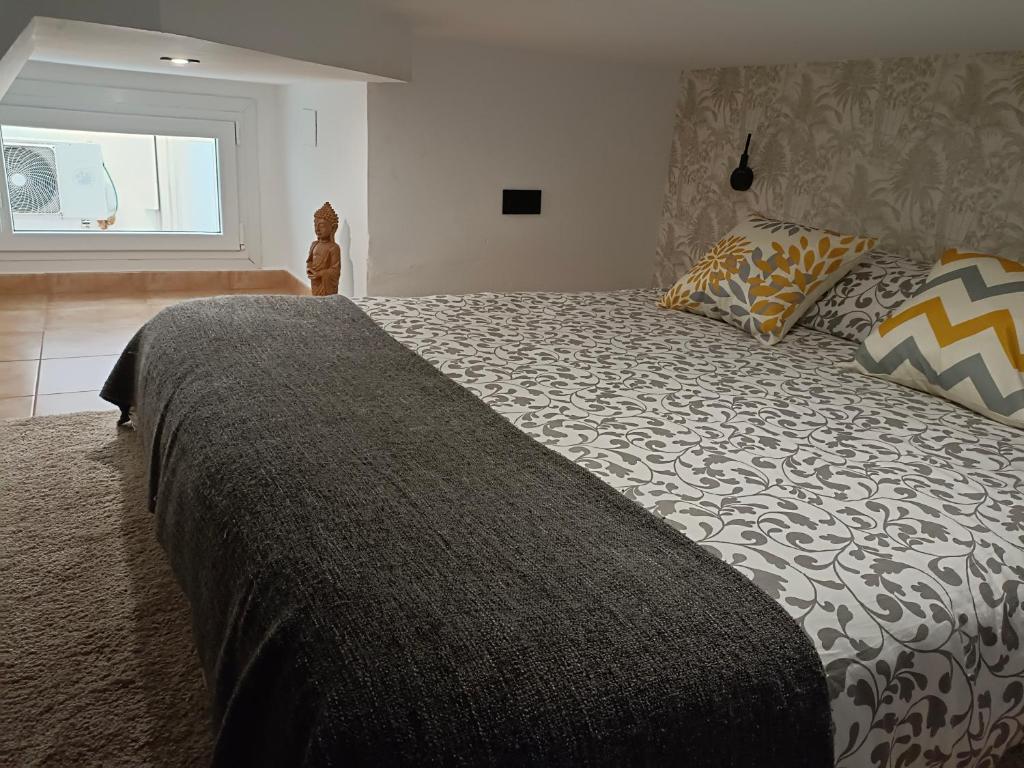 Posteľ alebo postele v izbe v ubytovaní Budha Luxury Apartment Centro Histórico de Málaga