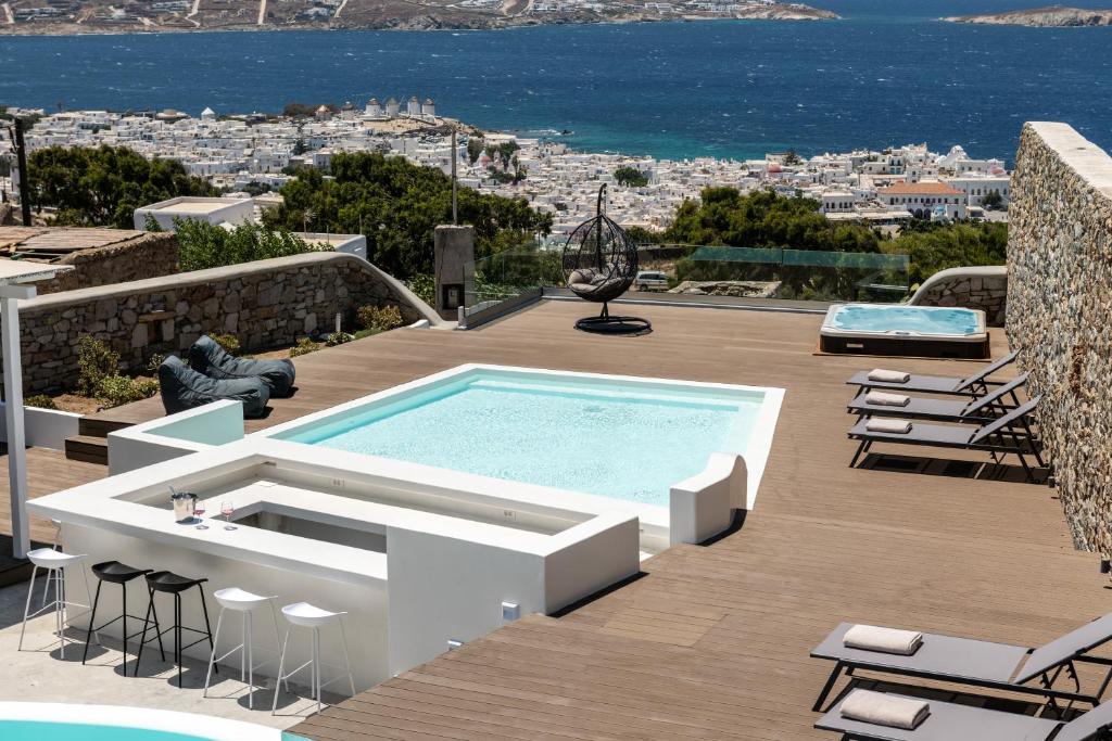 a swimming pool on a deck with a view of the ocean at Villa in Mykonos in Mikonos