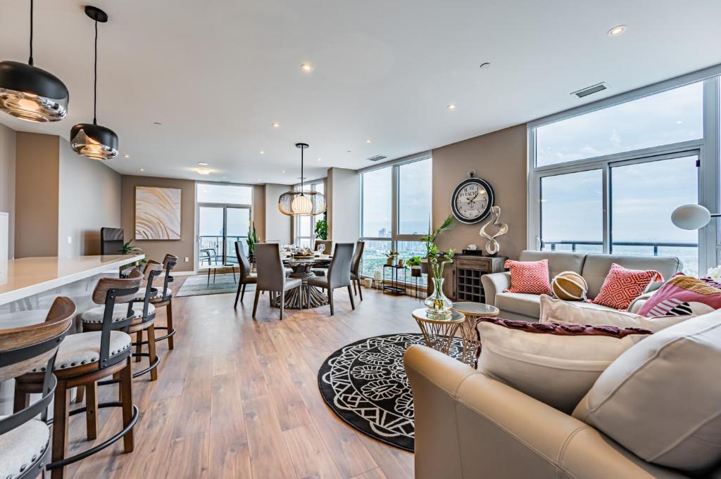 a living room with a couch and a table at Amazing 3 Bed 4 Bath Penthouse with Roof Top Terrace close to Airport in Mississauga