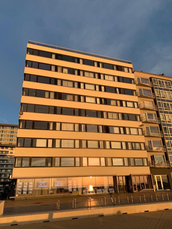 a large office building with a lot of windows at Wonderful architect designed flat with sea view in Ostend