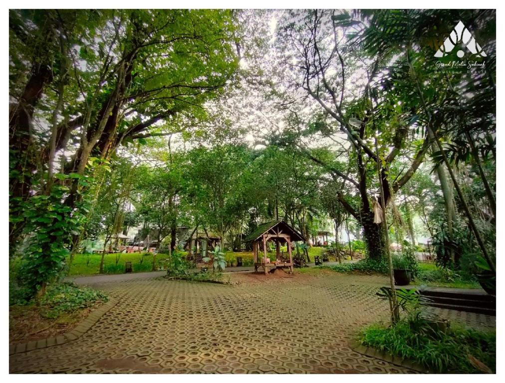 a park with a gazebo and trees at Grand Mulia Sakinah Resort & Outbond in Pasuruan