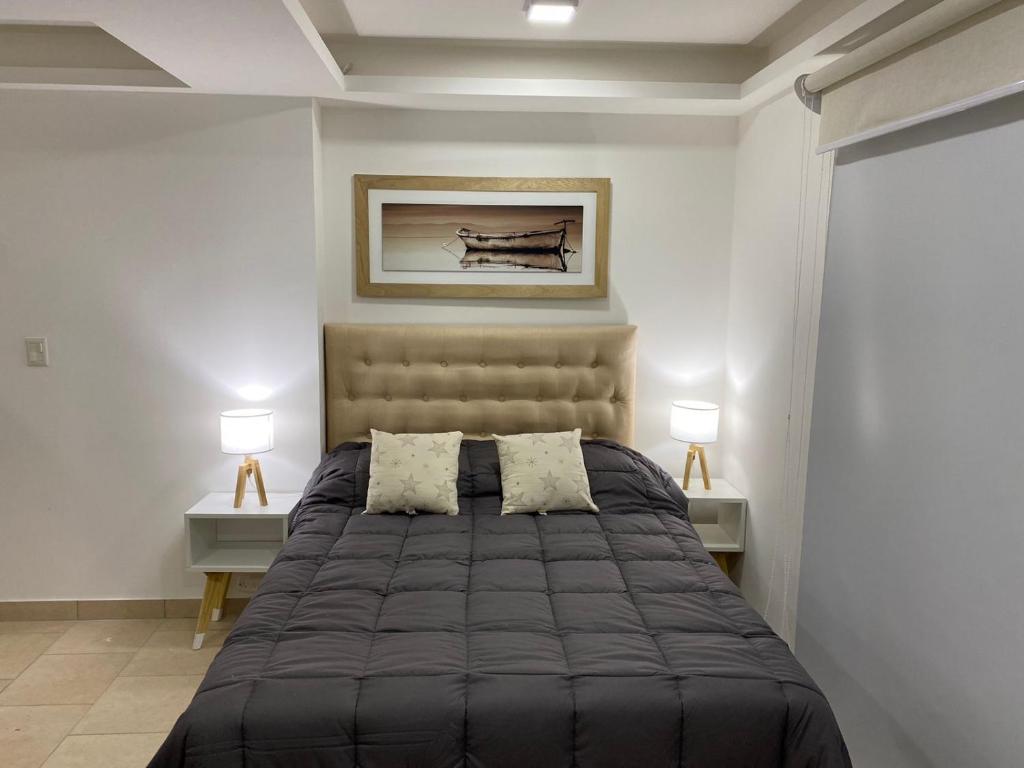Un pat sau paturi într-o cameră la Cielo Infinito II