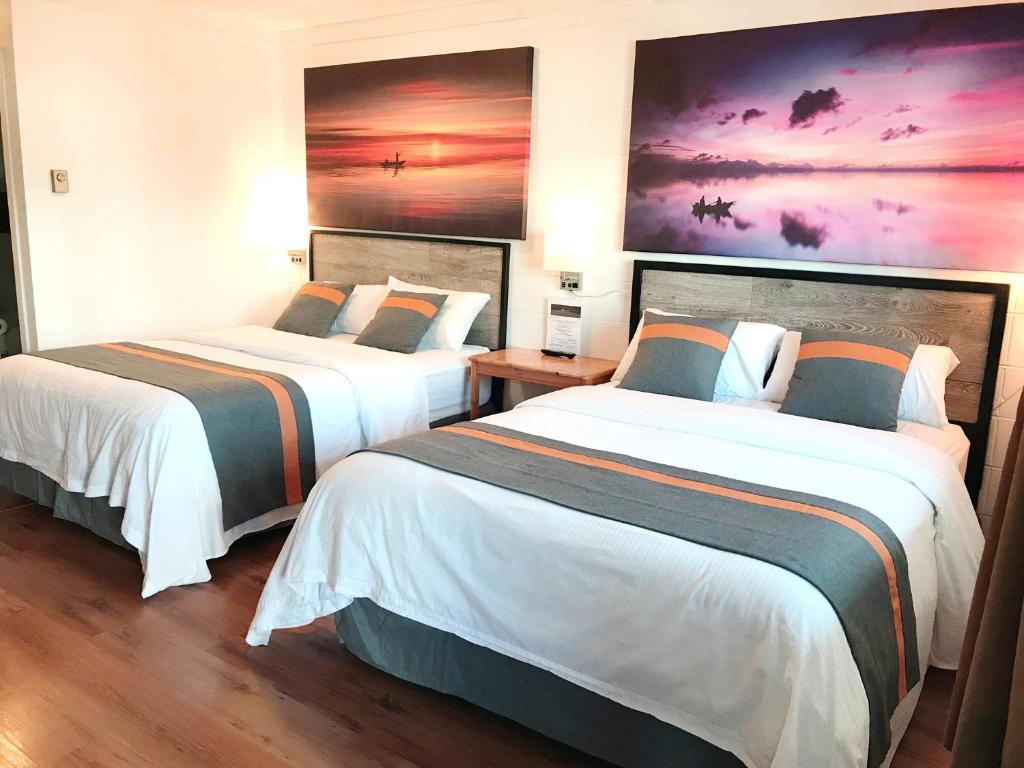 Postel nebo postele na pokoji v ubytování Duncan Motel