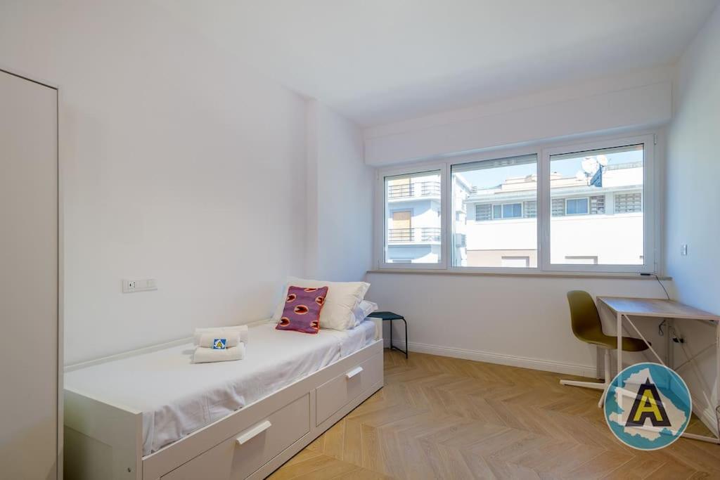 A bed or beds in a room at Favoloso nel cuore di Pescara a due passi dal mare