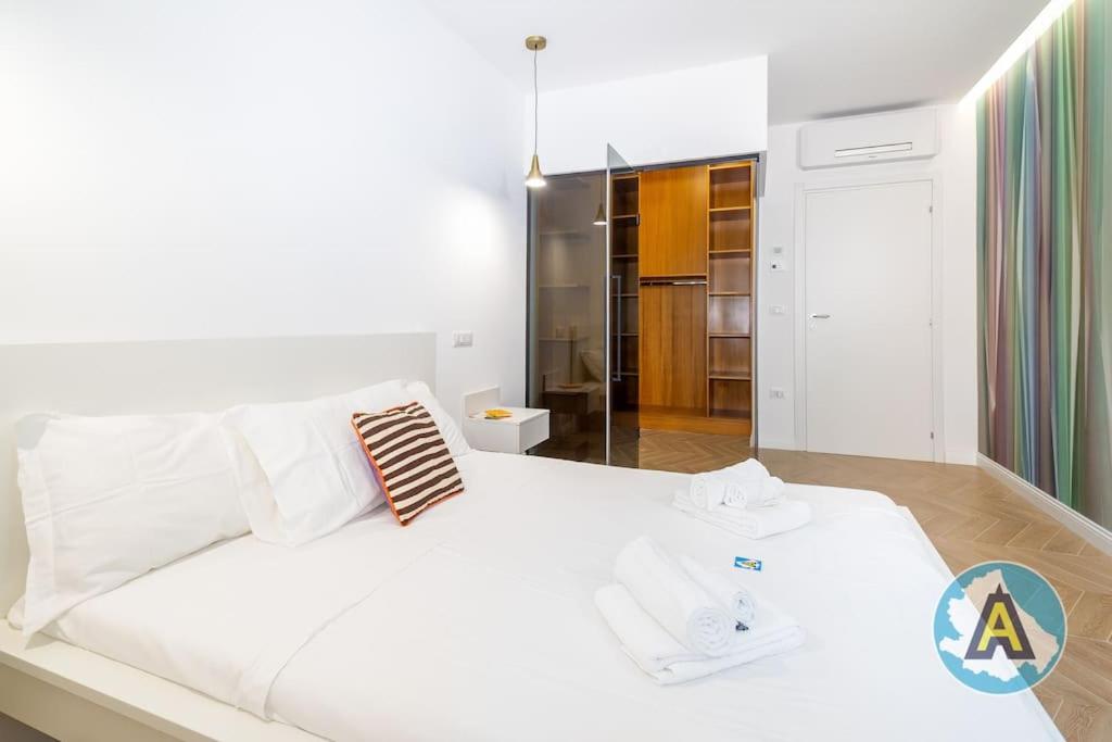A bed or beds in a room at Favoloso nel cuore di Pescara a due passi dal mare