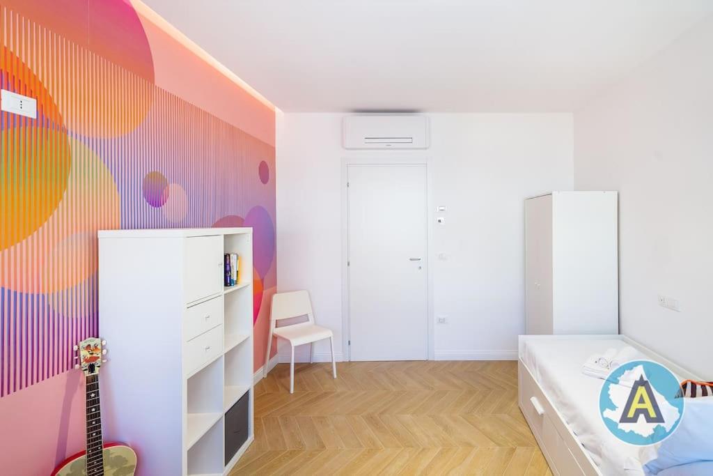 A bed or beds in a room at Favoloso nel cuore di Pescara a due passi dal mare