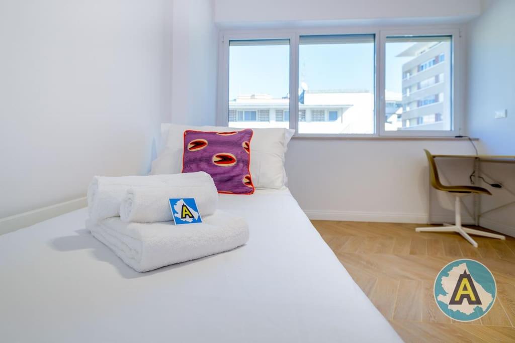 A bed or beds in a room at Favoloso nel cuore di Pescara a due passi dal mare