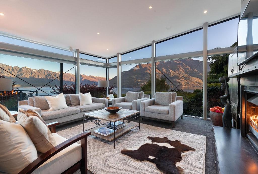 a living room with a view of the mountains at Remarkable Escape for 8 in Queenstown