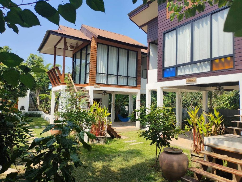 a house with a garden in front of it at Destiny Home Stay 