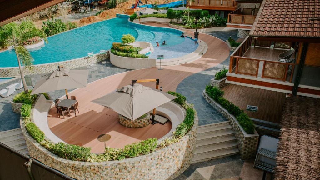 an overhead view of a swimming pool with an umbrella at Estancia de lorenzo in San Mateo