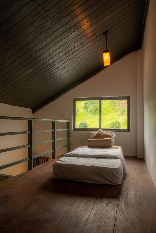 Postel nebo postele na pokoji v ubytování Kithal Ella Station Resort