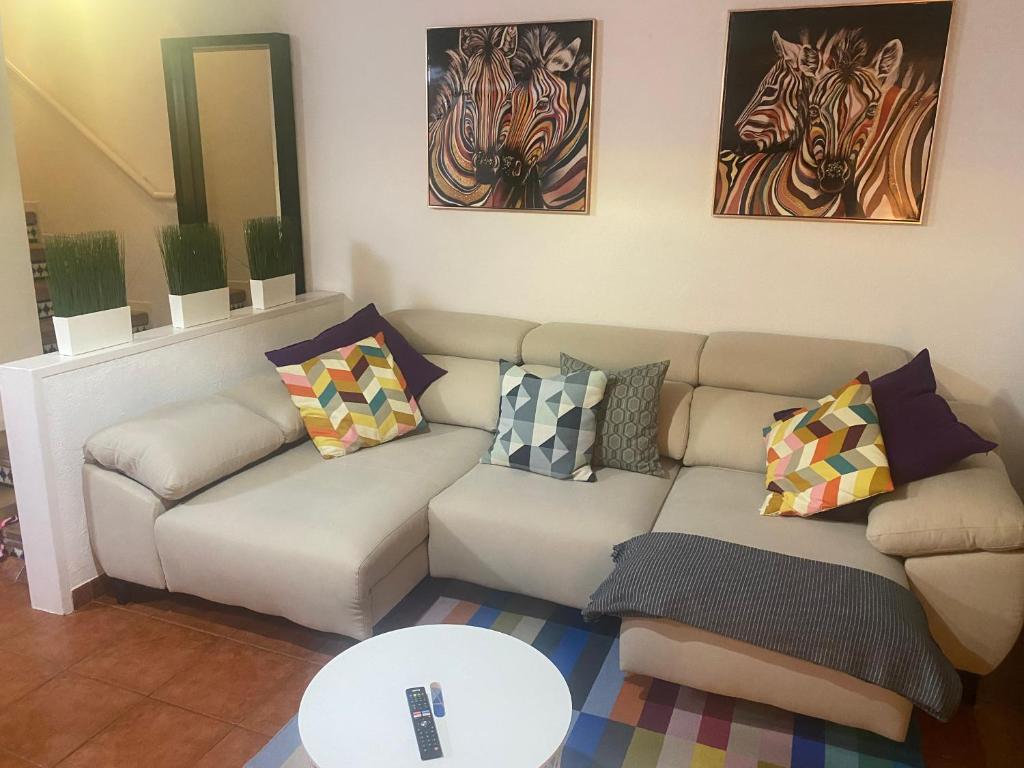 A seating area at Holiday house Parque Azul Playa La Arena FREE WIFI