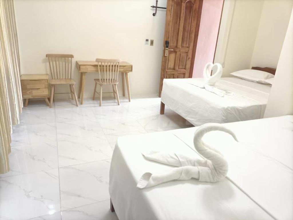 Llit o llits en una habitació de Speed 8 Inn Moalboal