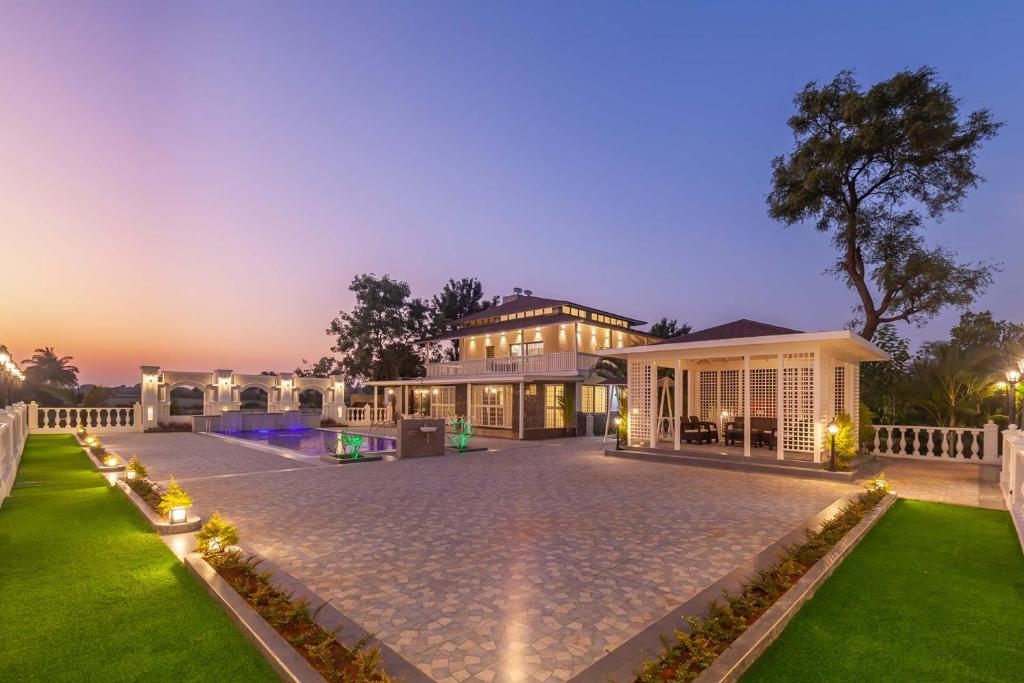 StayVista's Lake La Vie - Tranquil Lake-View Villa Amidst Farmland with Pool and Poolside Gazebo - Proximity to Sula - Villa