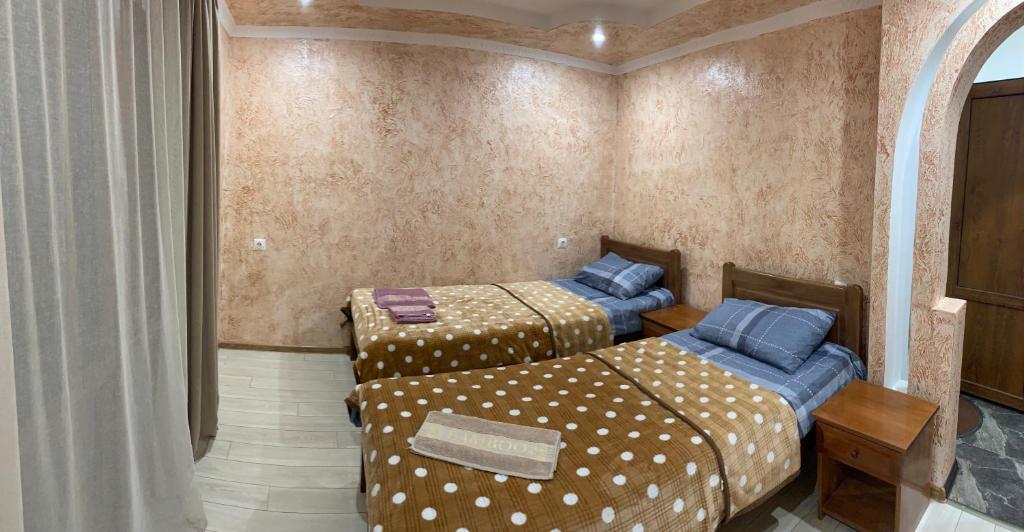 Postel nebo postele na pokoji v ubytování Guest House Diana