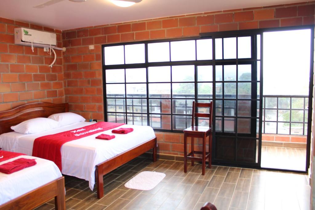 Postel nebo postele na pokoji v ubytování Hotel International