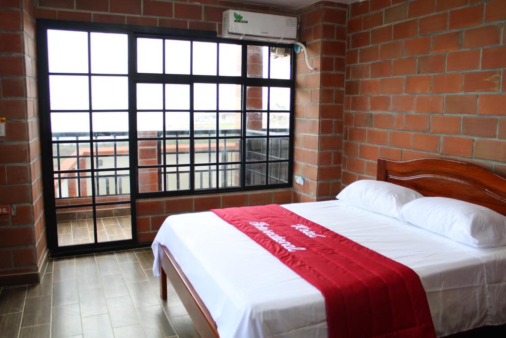 Postel nebo postele na pokoji v ubytování Hotel International