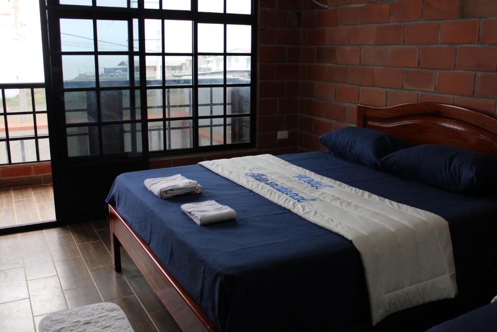 Postel nebo postele na pokoji v ubytování Hotel International