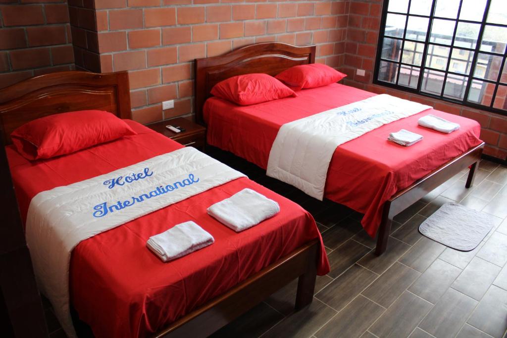 Postel nebo postele na pokoji v ubytování Hotel International