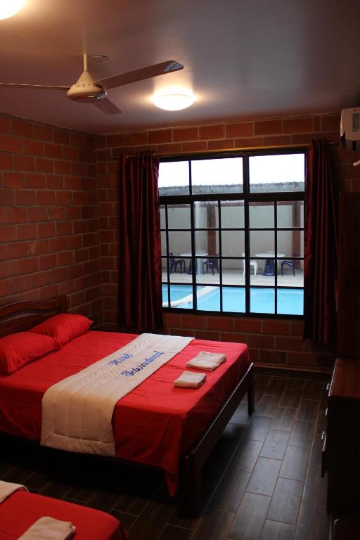 Postel nebo postele na pokoji v ubytování Hotel International
