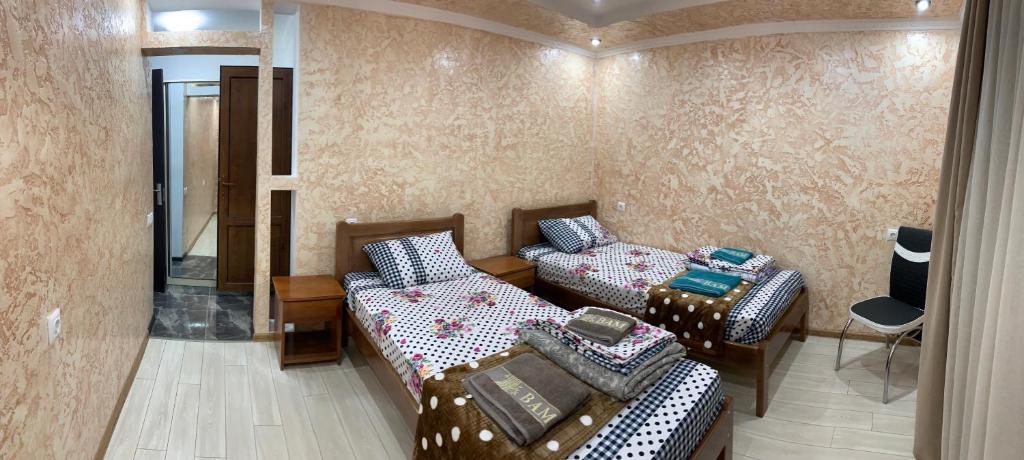 Postel nebo postele na pokoji v ubytování Guest House Diana
