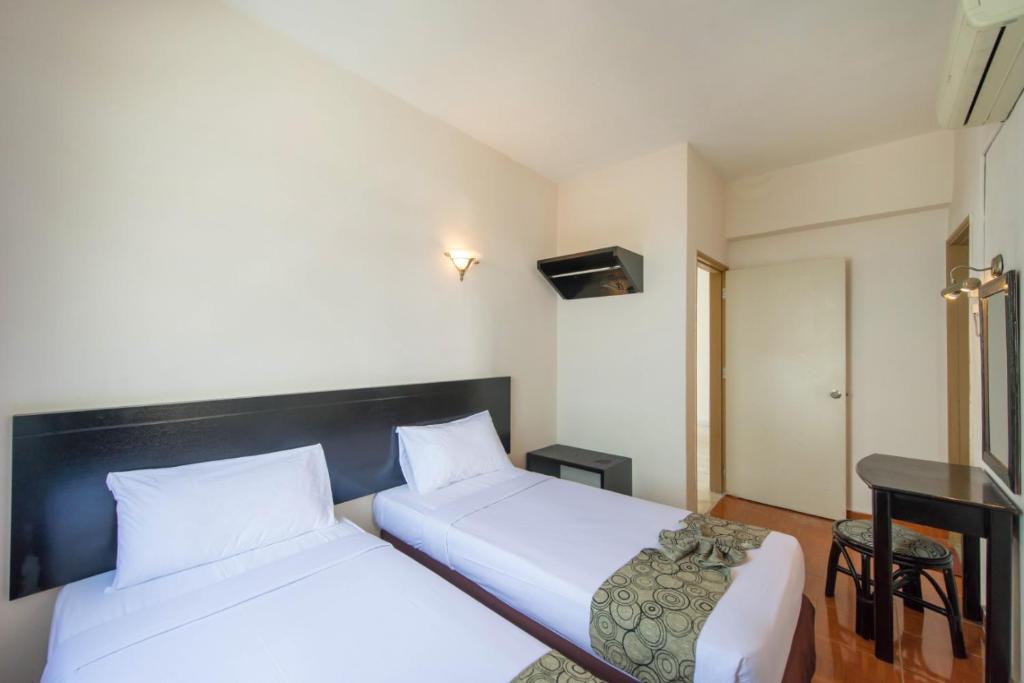 Postel nebo postele na pokoji v ubytování Glory Beach Resort