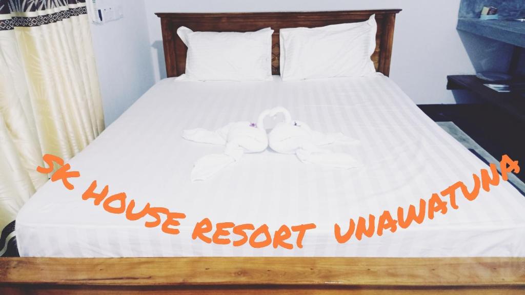 Postel nebo postele na pokoji v ubytování SK HOUSE RESORT UNAWATUNA