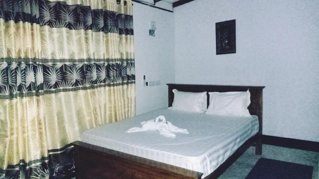Postel nebo postele na pokoji v ubytování SK HOUSE RESORT UNAWATUNA