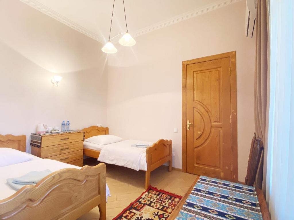 Postel nebo postele na pokoji v ubytování Hotel Magdalena