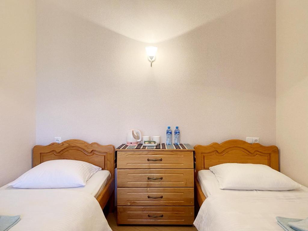 Postel nebo postele na pokoji v ubytování Hotel Magdalena