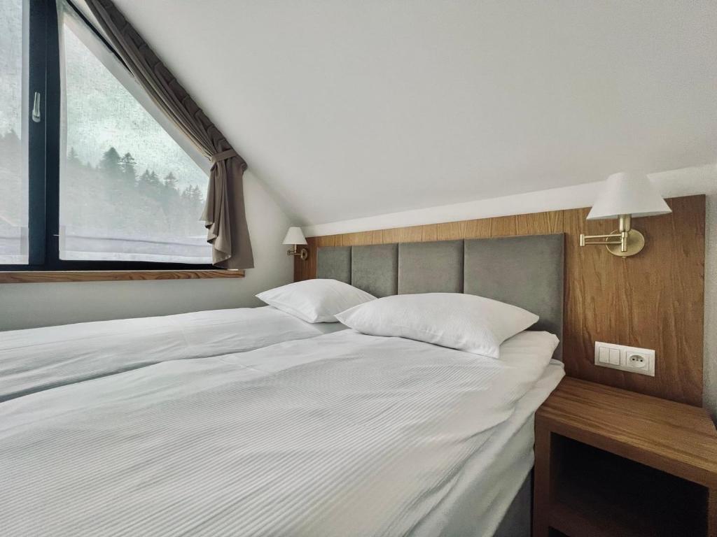 Łóżko lub łóżka w pokoju w obiekcie Jabłonki Resort&Spa