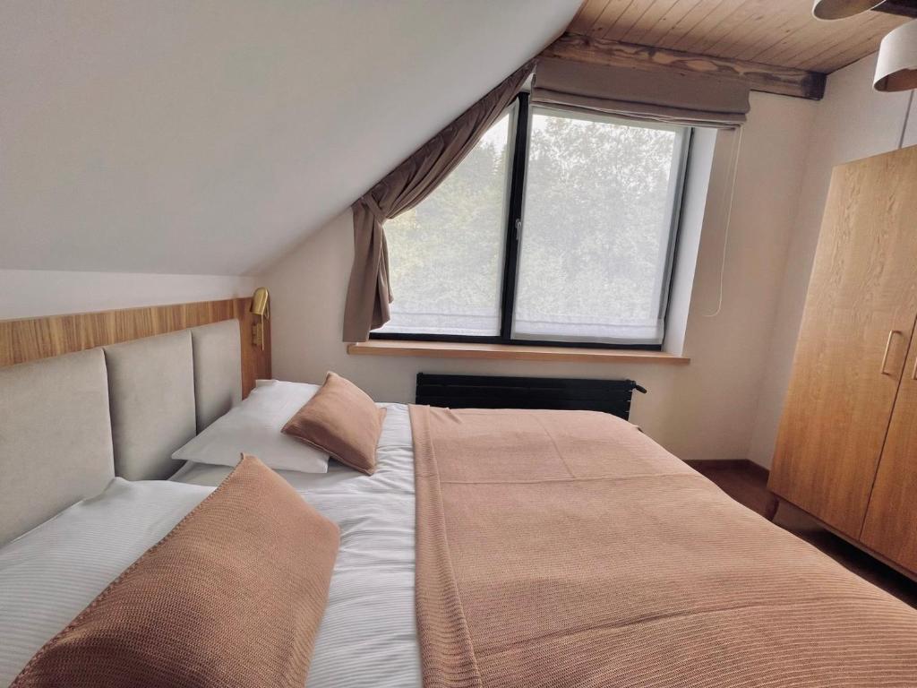 Łóżko lub łóżka w pokoju w obiekcie Jabłonki Resort&Spa